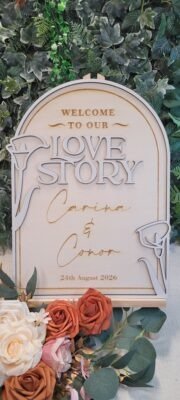 Personalised Love Story wedding welcome sign with arched wooden design and layered lettering